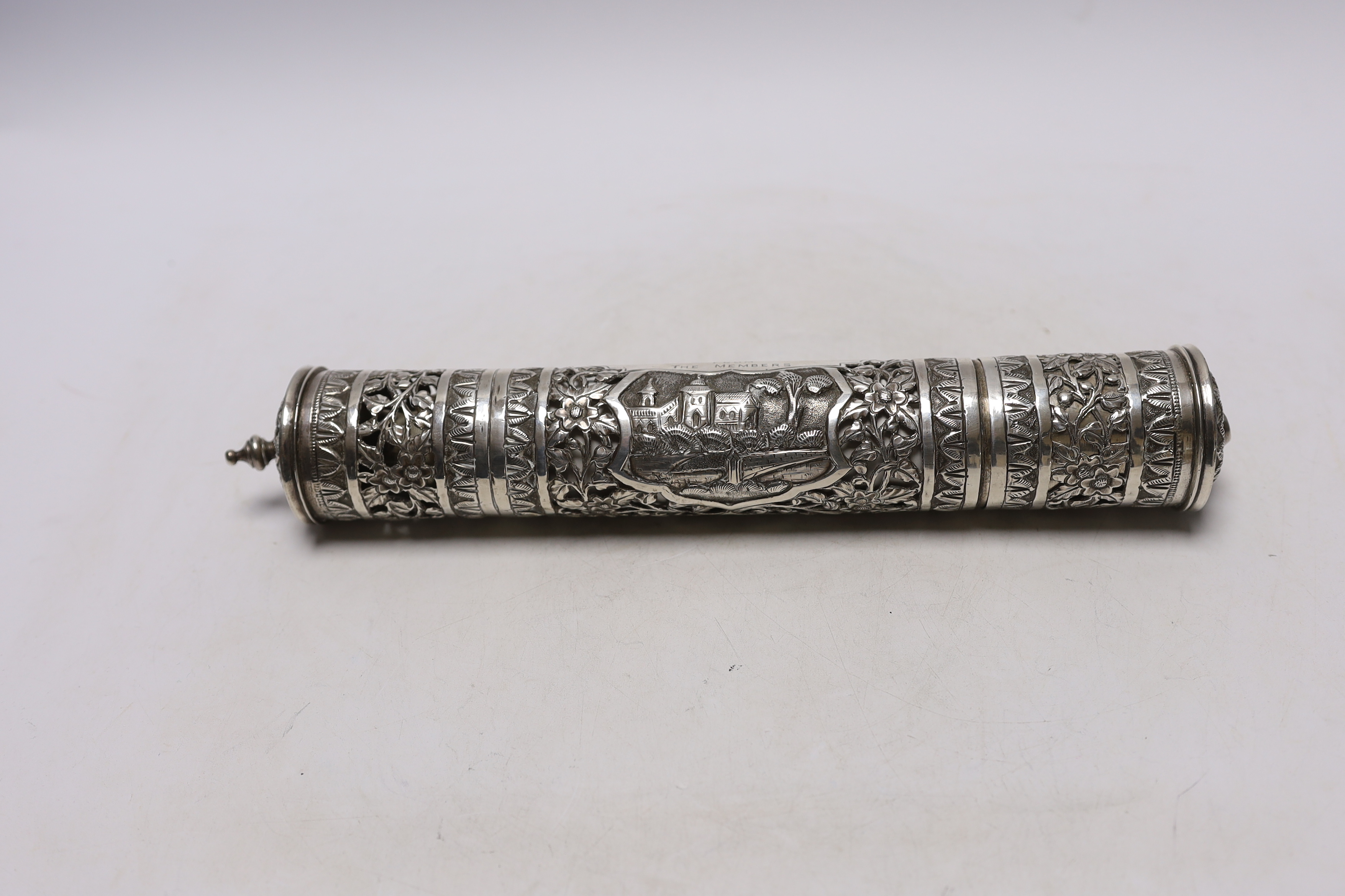 A mid 20th century Indian pierced white metal presentation scroll case to 'To A.J. Kendrick Esq. President Railway Institute Bandra, From The Members', 31.7cm, containing a silk scroll dedicated to the recipient